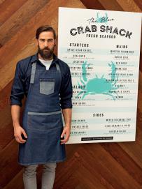 Premier förkläde med lapp "domain"